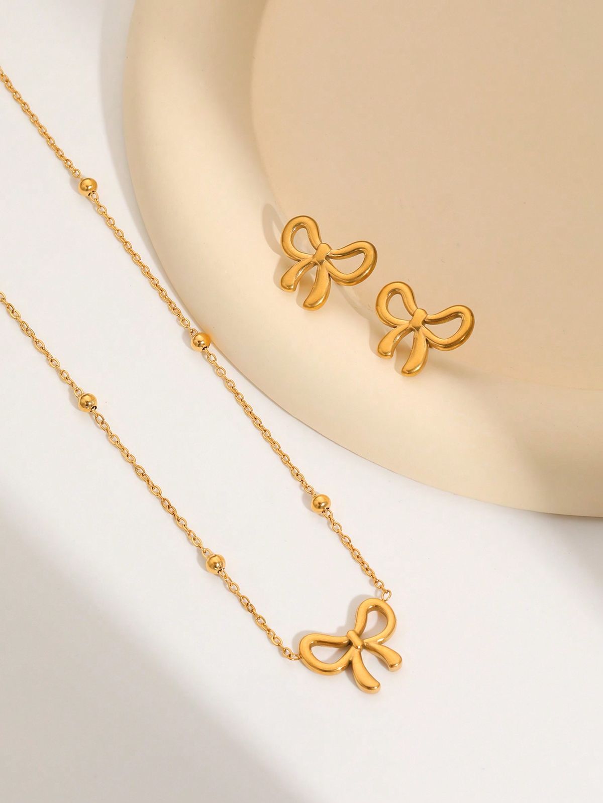 Minimalist Gold Plated Stainless Steel Bow Shaped Locket Earing Set