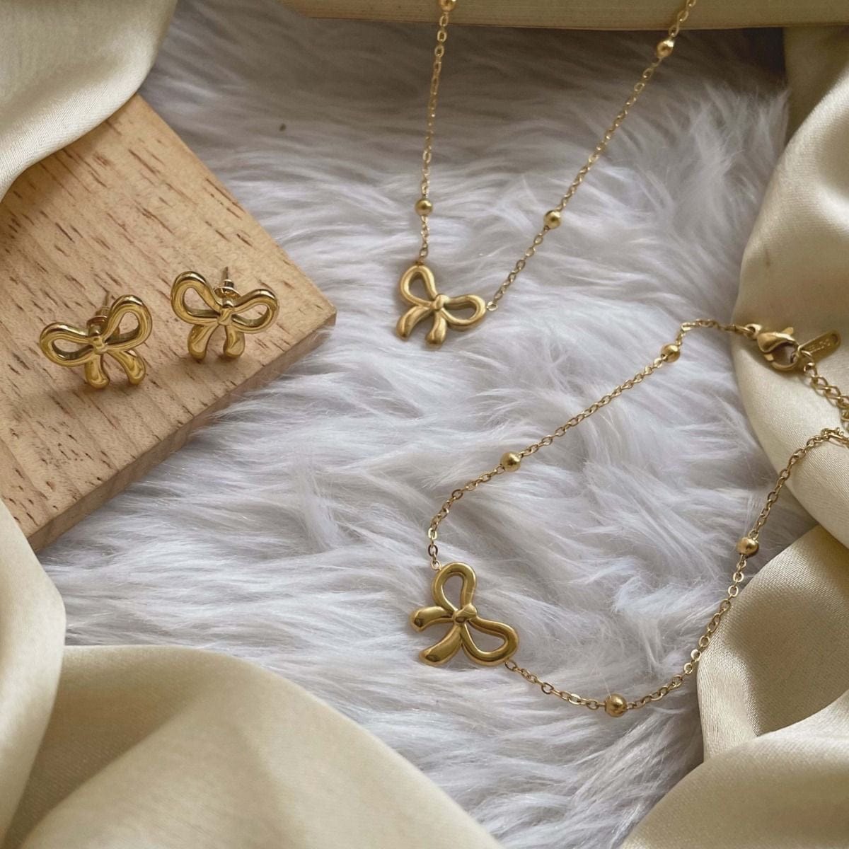 Minimalist Gold Plated Stainless Steel Bow Shaped Locket Earing Set